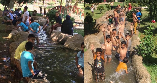 İslahiye'de çocuklar süs havuzunda serinliyor