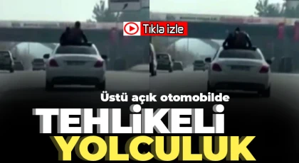 Üstü açık otomobilde tehlikeli yolculuk kamerada