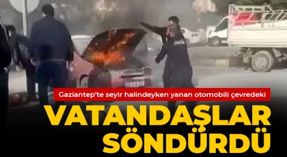 Seyir halindeyken yanan otomobili çevredeki vatandaşlar söndürdü