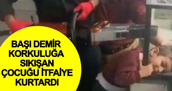 Başı demir korkuluğa sıkışan çocuğu itfaiye kurtardı