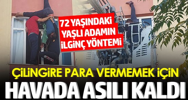 Evine çatıdan girmek istedi: Halat kısa gelince metrelerce yüksekte asılı kaldı