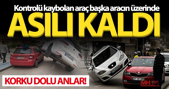 Kaza yapan araç park halindeki aracın üzerinde asılı kaldı 
